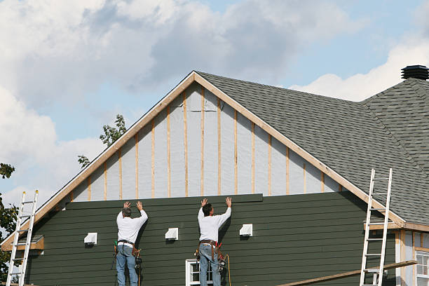 Professional Storm Damage Siding Repair technician working in Beverly, MA